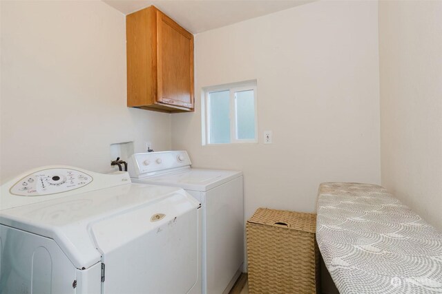 10012 Brush Arbor Ln NW, Seabeck, WA 98380 - washroom featuring separate washer and dryer and cabinet space