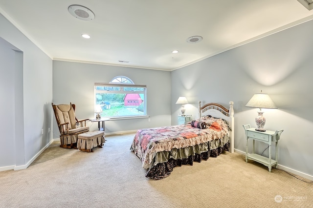 carpeted bedroom featuring crown molding