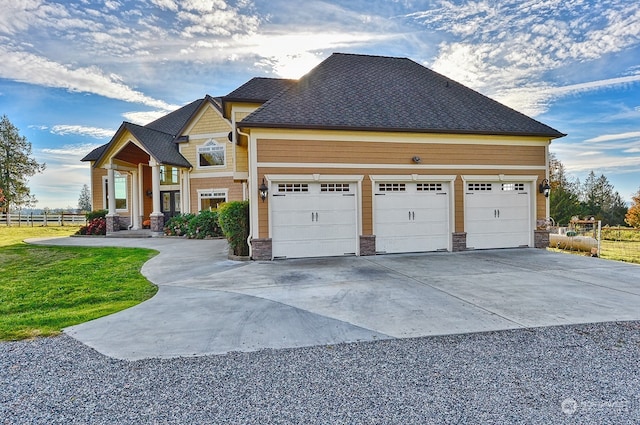 craftsman inspired home with a front lawn and a garage