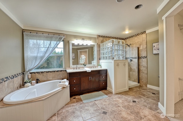 bathroom featuring vanity, independent shower and bath, and tile patterned flooring