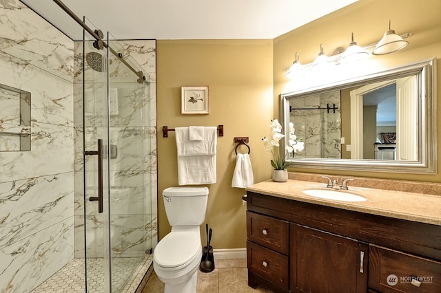 bathroom featuring vanity, toilet, walk in shower, and tile patterned flooring