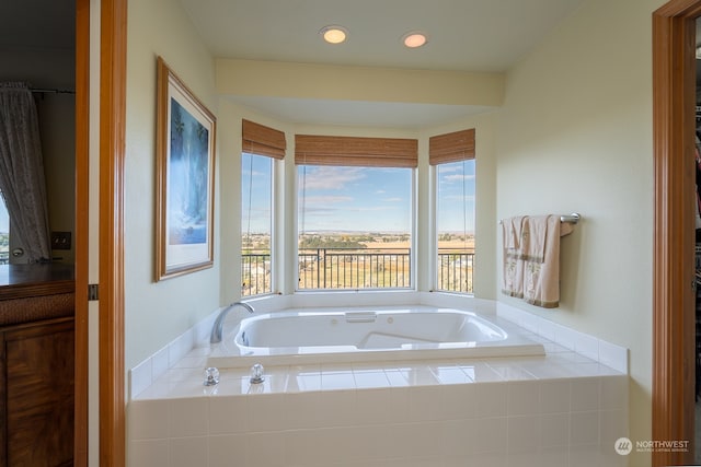 bathroom with tiled tub