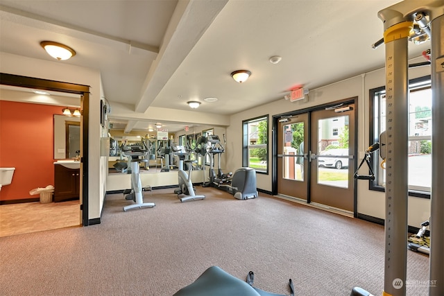 gym with carpet floors and french doors