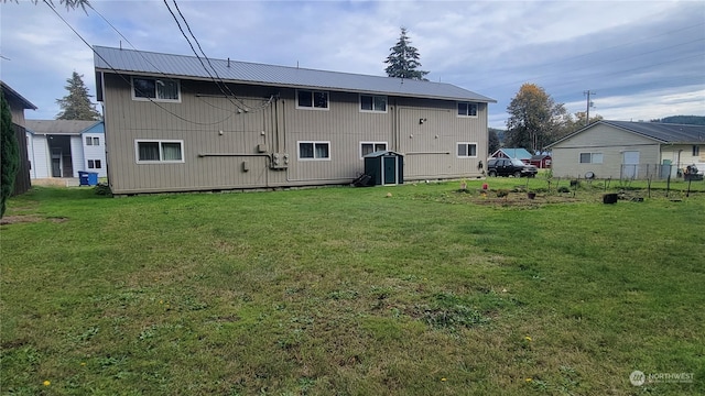 rear view of house with a lawn