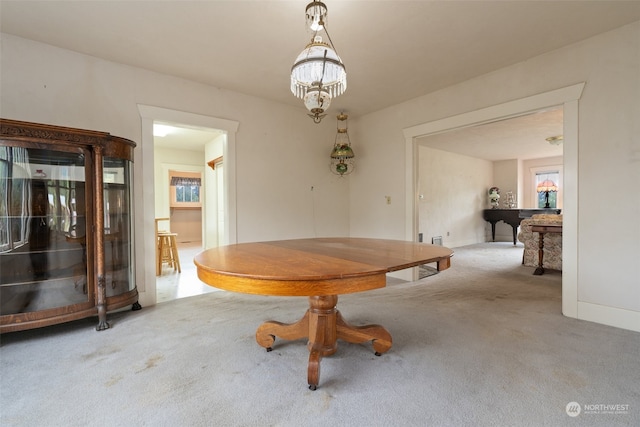 unfurnished dining area featuring carpet