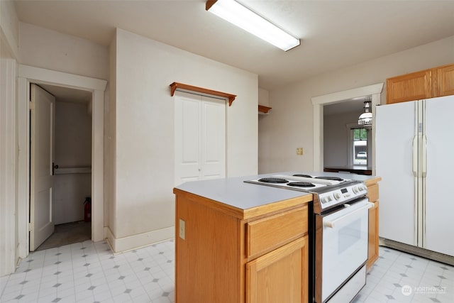 kitchen featuring a kitchen island and white appliances