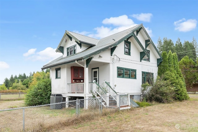 view of front of home featuring covered porch and central AC unit