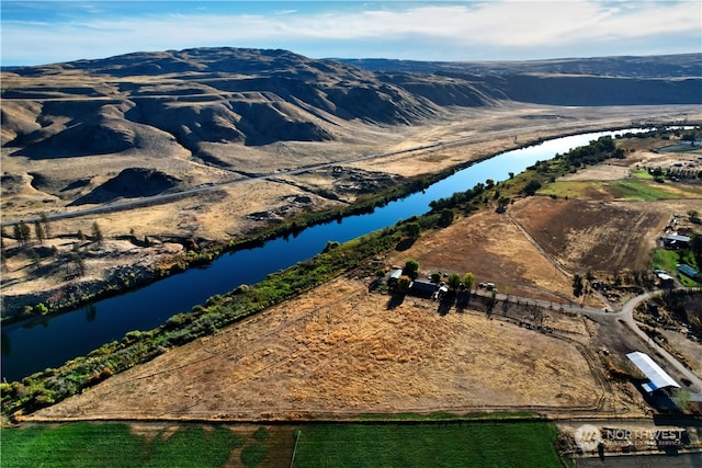 bird's eye view featuring a water and mountain view