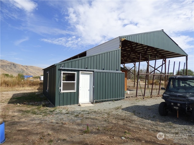 view of outbuilding with a mountain view