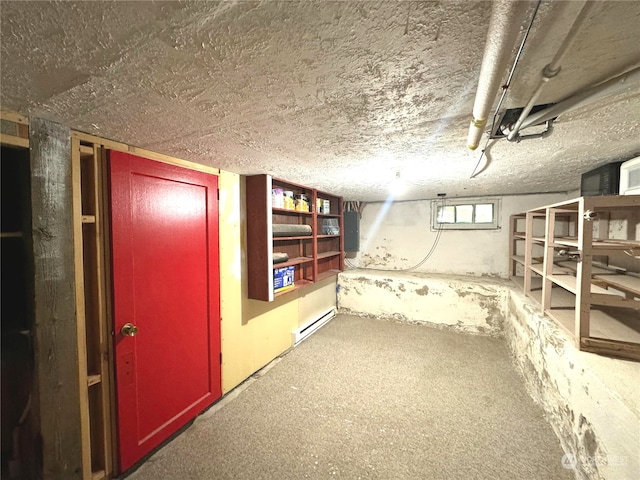 basement featuring electric panel and a baseboard radiator