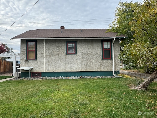 view of property exterior featuring a yard