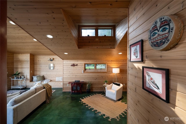 interior space with concrete floors, wood walls, and wood ceiling