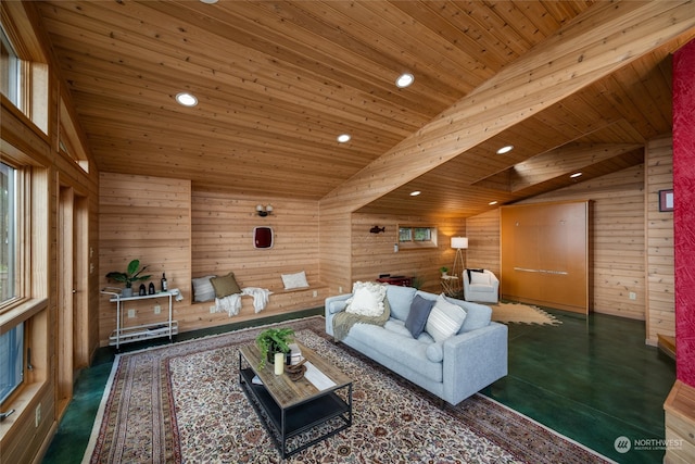 living room featuring lofted ceiling with skylight, wood walls, and wood ceiling