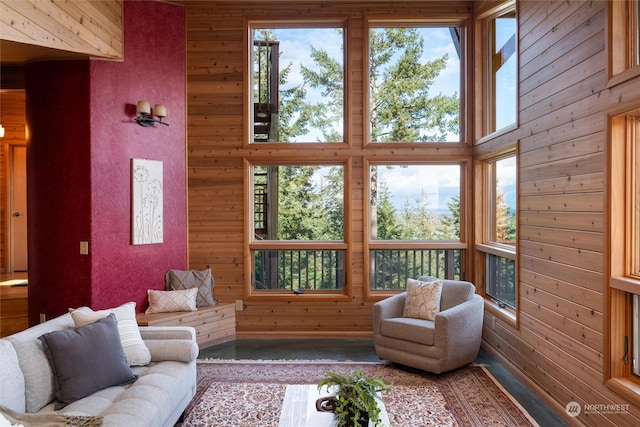 living room with wood walls