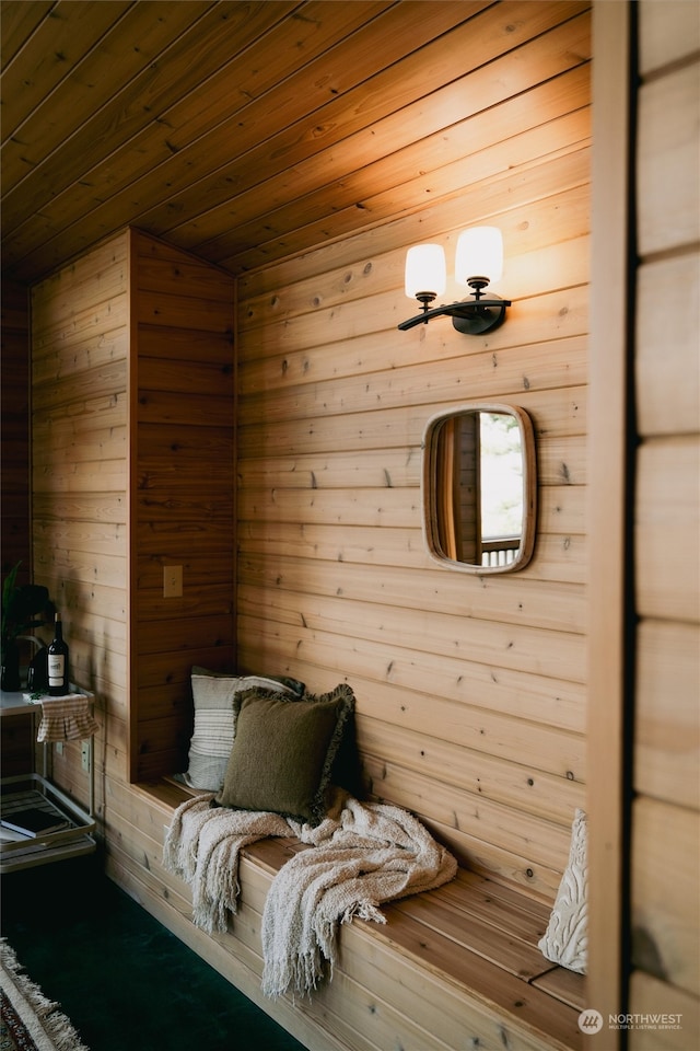 view of sauna / steam room with wooden walls and wood ceiling