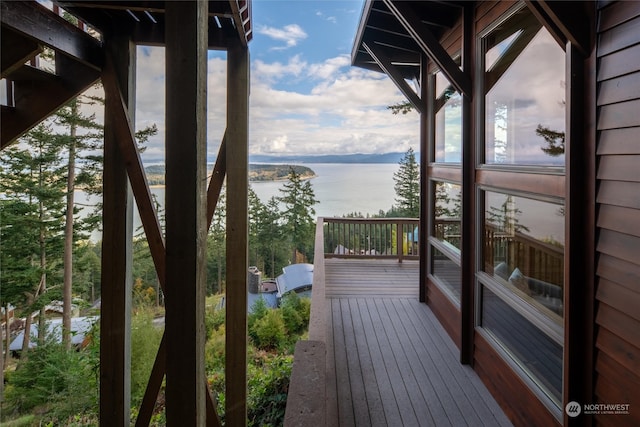 wooden deck with a water view