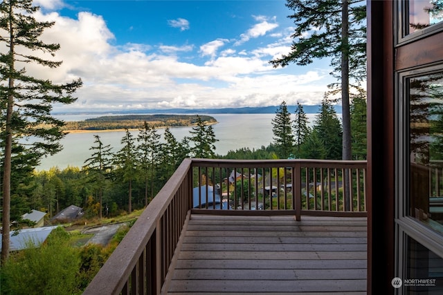 wooden deck featuring a water view