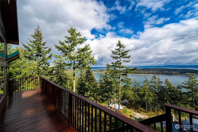 wooden terrace with a water view