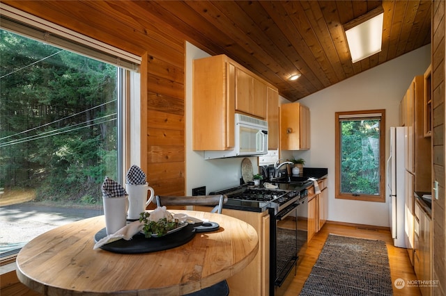 kitchen with white appliances, sink, wood ceiling, light hardwood / wood-style floors, and vaulted ceiling