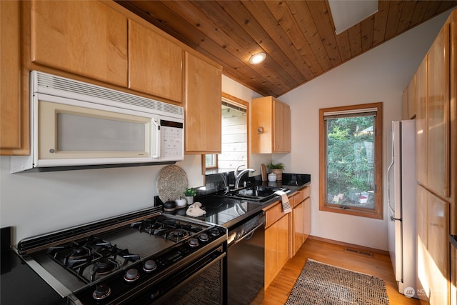 kitchen with wood ceiling, sink, black appliances, vaulted ceiling, and light hardwood / wood-style floors