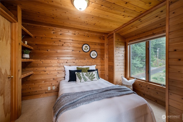 carpeted bedroom with wood ceiling, wood walls, and vaulted ceiling