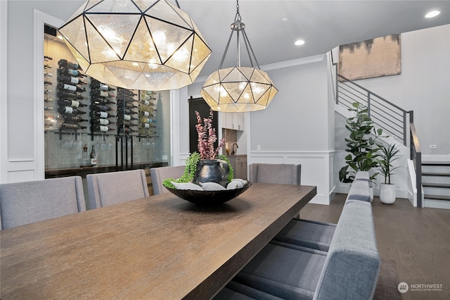 dining room with dark hardwood / wood-style floors and ornamental molding