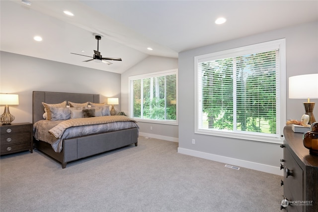 carpeted bedroom featuring vaulted ceiling and ceiling fan