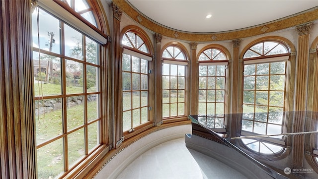 sunroom / solarium featuring a healthy amount of sunlight