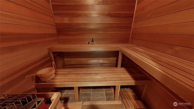 view of sauna / steam room featuring wood walls