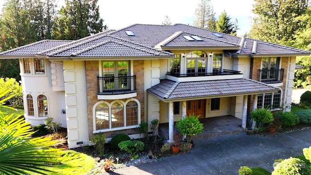 view of front of home with a balcony