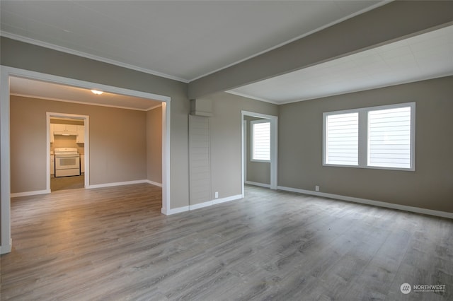 unfurnished room with light hardwood / wood-style floors and ornamental molding