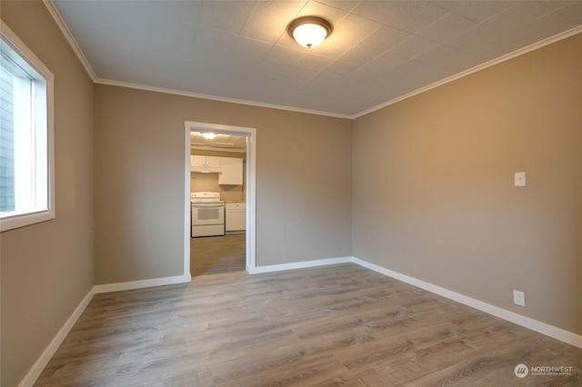 unfurnished room featuring light hardwood / wood-style flooring and ornamental molding