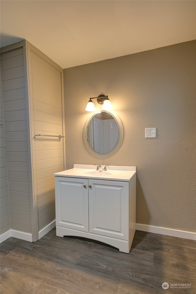 bathroom featuring vanity and hardwood / wood-style flooring