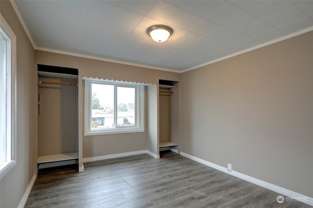 unfurnished bedroom featuring crown molding and hardwood / wood-style floors