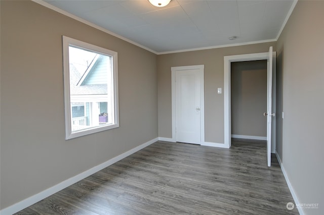 unfurnished bedroom featuring ornamental molding and hardwood / wood-style flooring