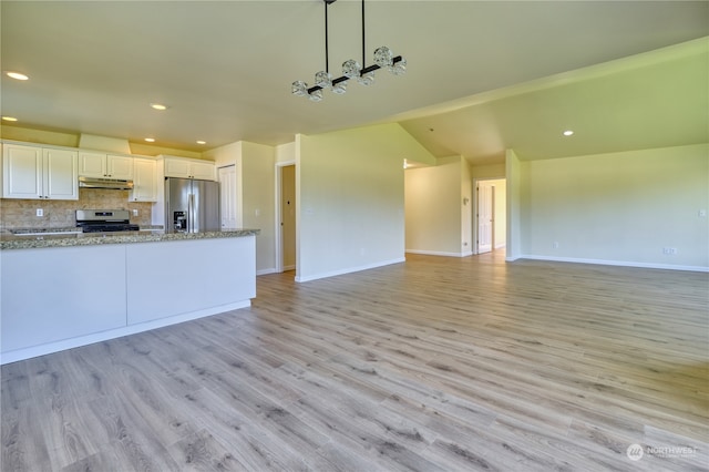 kitchen featuring appliances with stainless steel finishes, light wood-type flooring, and white cabinets