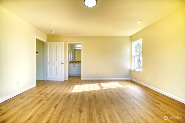 spare room with light wood-type flooring