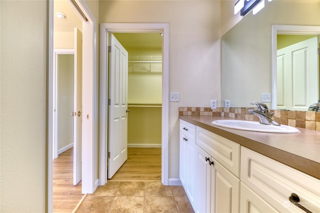 bathroom with vanity and hardwood / wood-style flooring