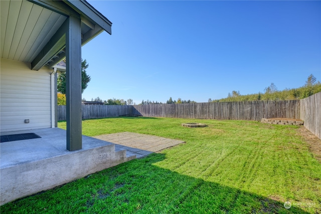 view of yard with a patio area and a fire pit