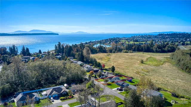 bird's eye view with a water and mountain view