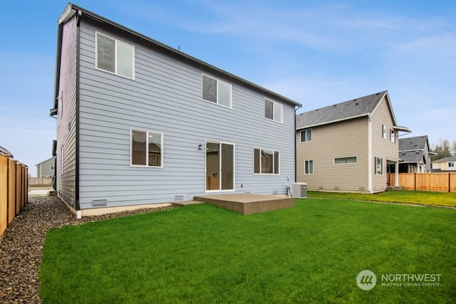 rear view of property with central AC, a patio area, and a lawn