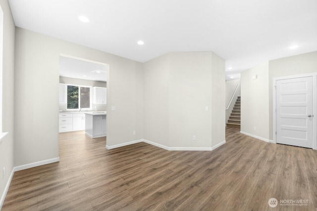 9865 Merrick St SE Unit 384, Yelm, WA 98597 - unfurnished living room featuring wood finished floors, recessed lighting, and stairs