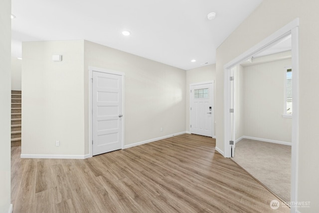 9865 Merrick St SE Unit 384, Yelm, WA 98597 - unfurnished room featuring stairs, wood finished floors, and recessed lighting