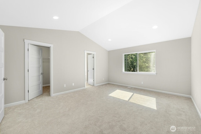 9865 Merrick St SE Unit 384, Yelm, WA 98597 - unfurnished bedroom featuring carpet, a spacious closet, vaulted ceiling, a closet, and recessed lighting