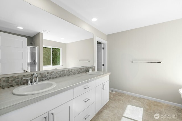 9865 Merrick St SE Unit 384, Yelm, WA 98597 - bathroom featuring a shower stall, tasteful backsplash, double vanity, and recessed lighting