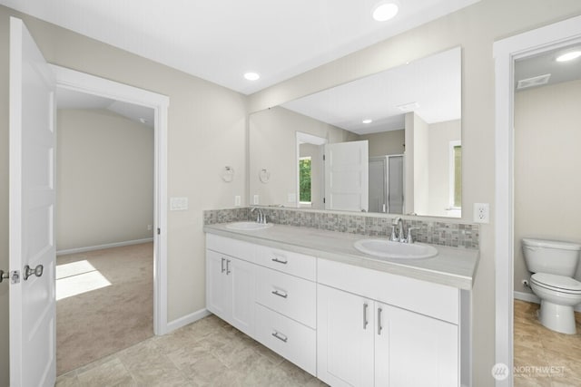 9865 Merrick St SE Unit 384, Yelm, WA 98597 - bathroom featuring double vanity, a stall shower, decorative backsplash, and recessed lighting