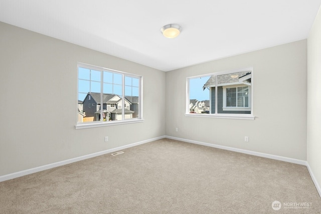 9865 Merrick St SE Unit 384, Yelm, WA 98597 - spare room featuring plenty of natural light and carpet flooring