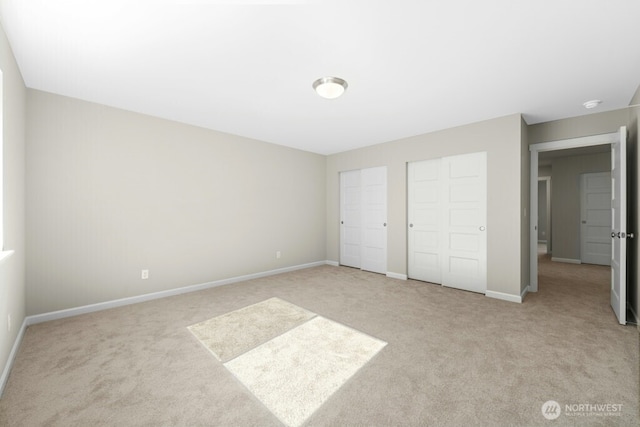 9865 Merrick St SE Unit 384, Yelm, WA 98597 - unfurnished bedroom featuring carpet and multiple closets