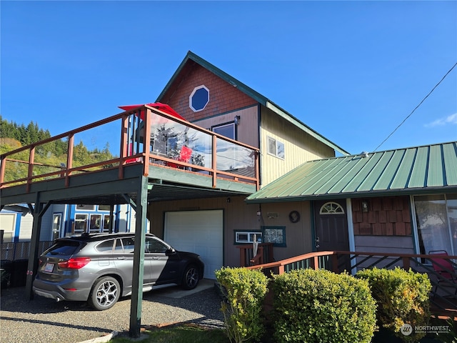 view of front of home featuring a balcony and a garage