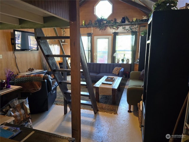 living room featuring wood walls